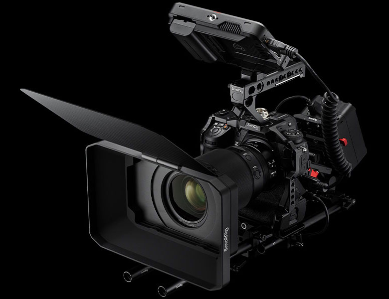 Product photo of the Z 9 mirrorless camera in a rig with video accessories including a loupe and external LCD